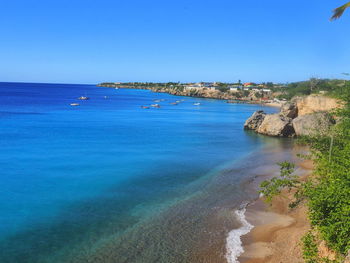 Scenic view of sea against clear blue sky