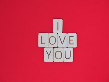 Close-up of i love you text against red background