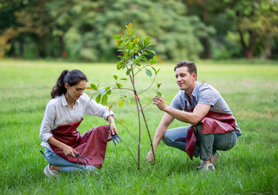 Friends sitting on field