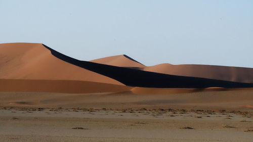 Scenic view of desert against clear sky