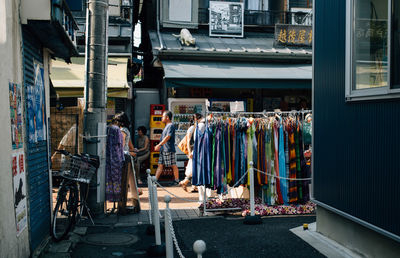 Multi colored clothes hanging on built structure