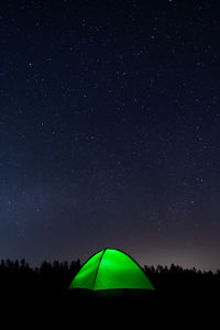 Low angle view of tent against sky at night