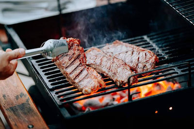 Close-up of meat cooking on barbecue grill