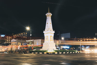 Illuminated buildings in city at night