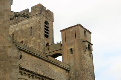 Low angle view of old building against sky