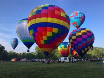 Multi colored hot air balloon against sky