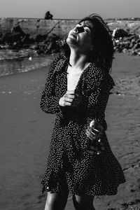 Woman standing at beach