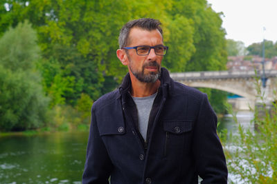 Man standing by lake