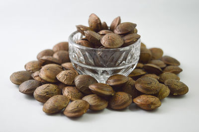 Close-up of coffee beans against white background