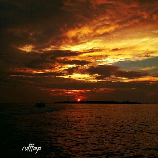 sunset, water, sea, scenics, sky, beauty in nature, tranquil scene, tranquility, orange color, waterfront, horizon over water, cloud - sky, idyllic, nature, nautical vessel, transportation, sun, boat, dramatic sky, cloud