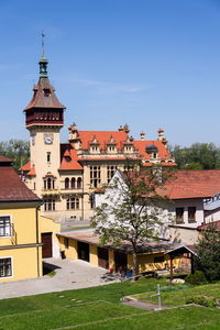 Houses and buildings against blue sky