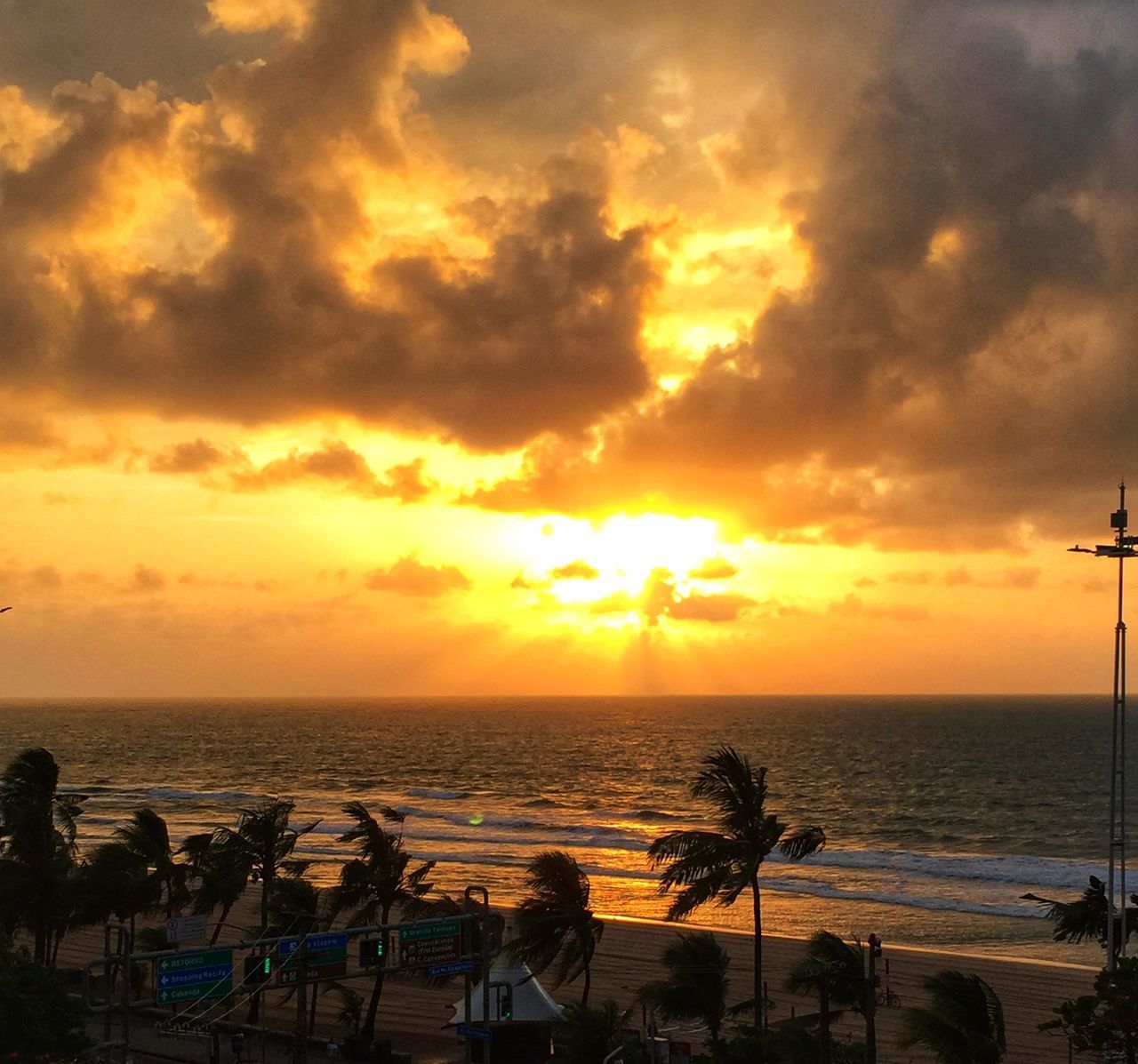 SCENIC VIEW OF SUNSET OVER SEA