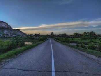 Surface level of empty road against sky