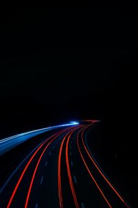 High angle view of light trails on road at night