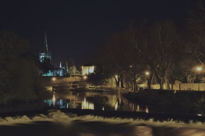 Reflection of illuminated buildings in water at night