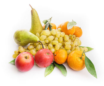 Close-up of apples and fruits on white background