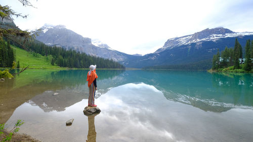 People enjoy view of landscape emerald lake, banff, alberta, canada