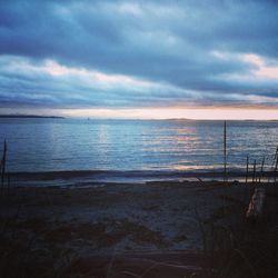 Scenic view of sea against cloudy sky