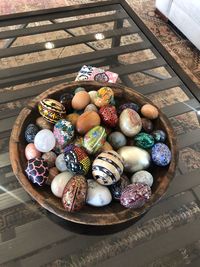 High angle view of multi colored eggs on table