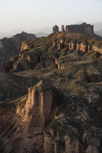 Rock formations on mountain against sky