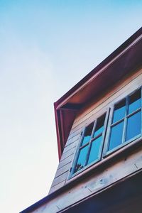 Low angle view of building against blue sky