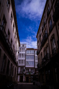 Low angle view of buildings in city against sky