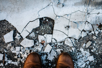 Low section of man standing on floor