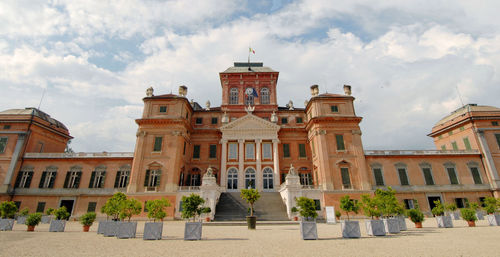 Facade of historic building against sky