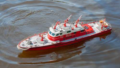 Remote controlled ship model is remote controlled on a lake