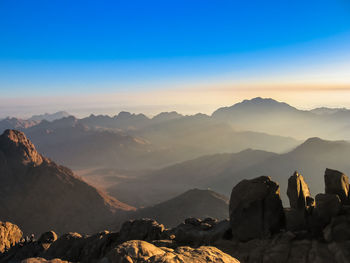 Scenic view of mountains against sky during sunset