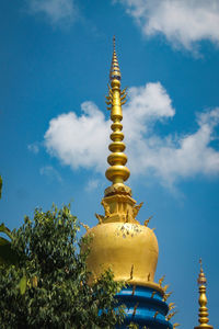 Low angle view of traditional building against blue sky