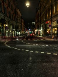 Illuminated city street at night