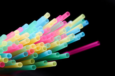 Close-up of colorful balls against black background