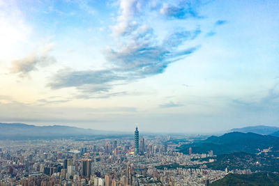 High angle view of city against cloudy sky