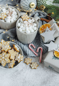 Hot chocolate with marshmallows, warm cozy christmas drink, gingerbread cookies and decorations