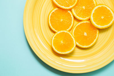 Directly above shot of orange fruit against white background