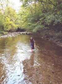 Boy standing in water