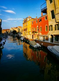 Boats moored at harbor