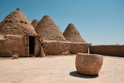 Traditional mud brick made beehive houses. village of beehive houses opposite clear sky