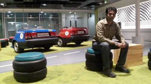 Full length portrait of man standing in car