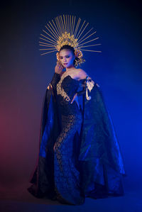 Portrait of woman standing against sky