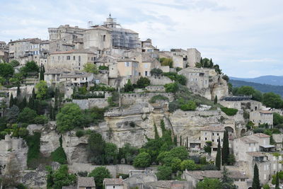 Buildings in city against sky