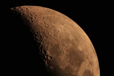 Close-up of moon over black background