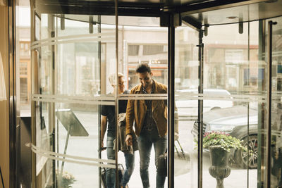 Woman standing by window