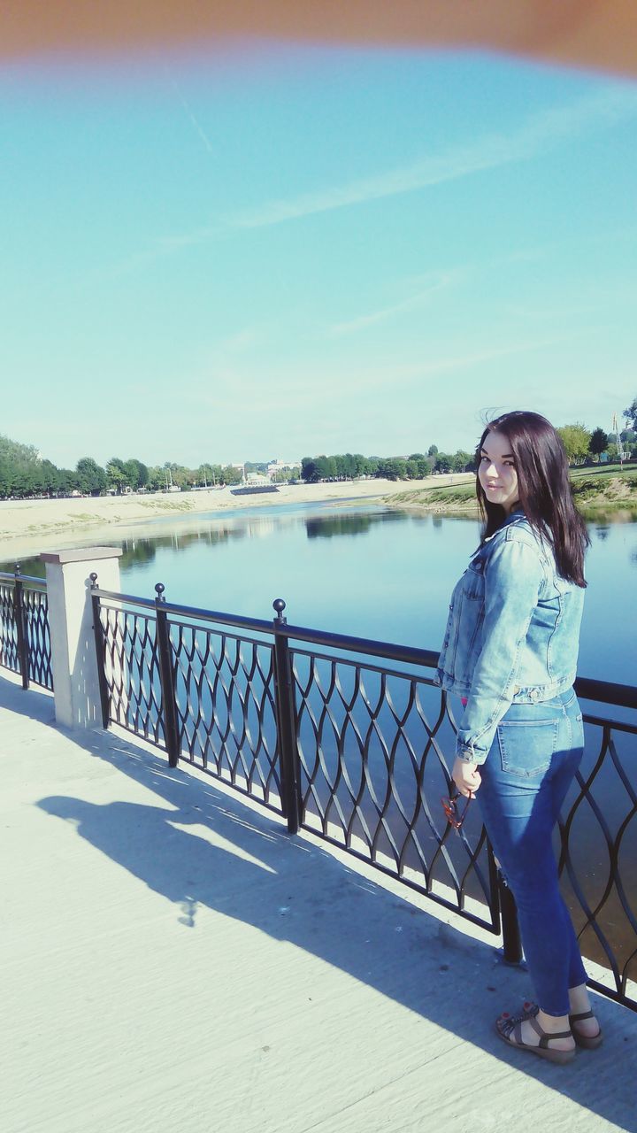 lifestyles, water, leisure activity, casual clothing, full length, railing, blue, standing, rear view, person, childhood, elementary age, sea, lake, sky, river, day, boys