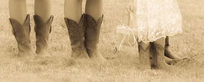 Low section of woman standing on grass