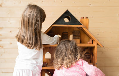 Rear view of girl at home