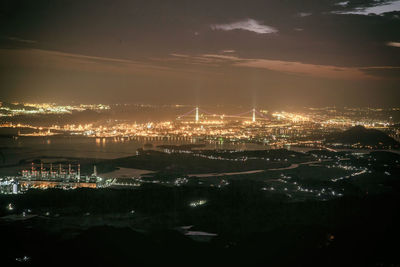 High angle view of illuminated buildings in city at night