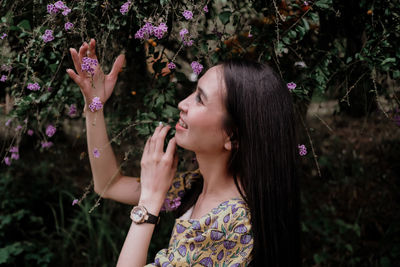 Portrait of woman with pink flowers