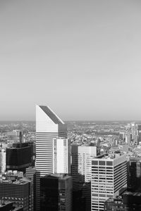 High angle view of buildings in city against clear sky